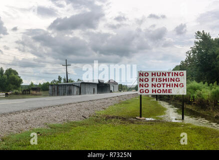 A sign discourages visitors at Motiva Enterprises, an oil refinery in Convent, Louisiana. Motiva also owns refineries in Norco, Louisiana, and Texas. Stock Photo