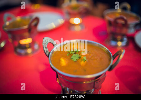 Red curry on wooden table in thailand Stock Photo