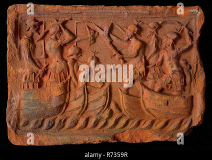 Hearthstone, from Antwerp Belgium, with narrow frame, with naval battle, fireplace stone part ceramic brick, baked Hearth of the Antwerp type with narrow list depicting naval battle in which armed and hardened men fight each other building history heat war Stock Photo