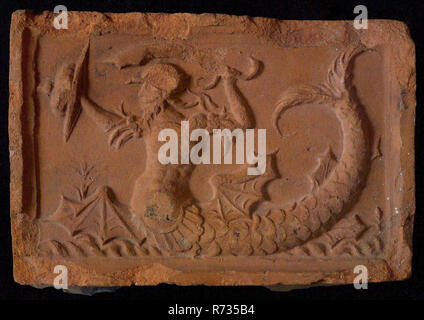 Hearthstone, from Antwerp Belgium, with narrow frame, with merman, fireplace stone part ceramics brick, fried Hearthstone of the Antwerp type with narrow frame depicting merman with shield and sword building history heating Stock Photo