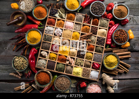 Close-up of different types of Assorted Spices in a wooden box Stock Photo