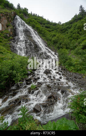 Portrait view of Bridal Veil Falls in Valdez Alaska in the Keystone Canyon Stock Photo