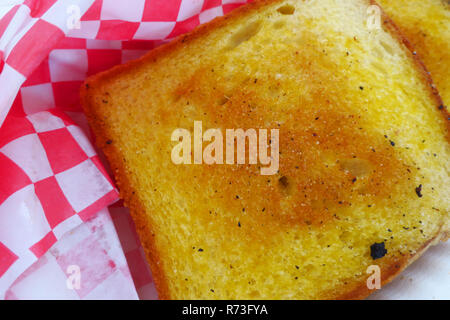 Garlic toast in red checker wrapping Stock Photo