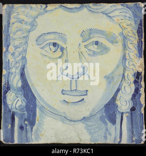 Tile of chimney pilaster, blue on white, head of woman with long curly hair, chimney pilaster tile pilaster footage fragment ceramic earthenware glaze, baked 2x glazed painted Stock Photo