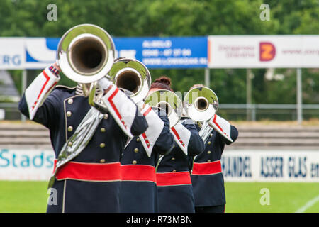 Details from a music, show and marching band. Playing musicians wind instruments in uniforms. Baritone, Mellofoon. Stock Photo