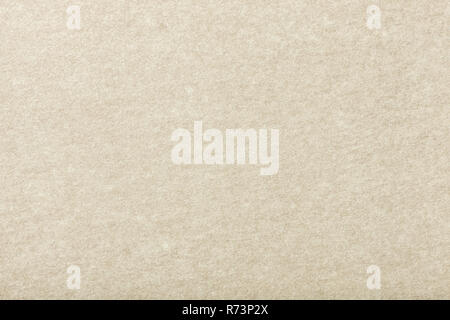 Light beige matte background of suede fabric, closeup. Velvet texture of seamless ivory woolen felt. Stock Photo