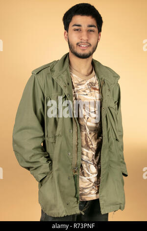 young man with green jacket Stock Photo
