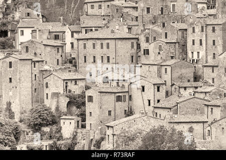 ancient medieval hill town Sorano, Tuscany, Italy in May - toned Stock Photo