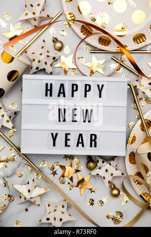 Happy new year lightbox celebration message with luxury gold party decorations Stock Photo