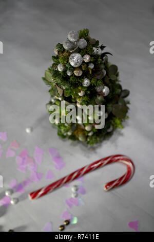 High angle view on peak of Christmas tree succulent composition with decorative pearl balls and bell shaped forms Stock Photo