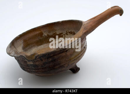 Pottery saucepan, red shard with sparing lead glaze, pouring lip, on three legs, saucepan pan crockery holder kitchenware soil discovery ceramics earthenware glaze lead glaze, hand turned fried glazed Pottery saucepan red shard with sparing lead glaze pouring lip three legs carbon footprints archeology indigenous pottery food prepare cooking eat cuisine Stock Photo