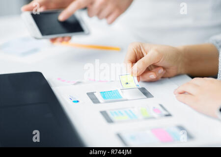 web designers creating mobile user interface Stock Photo