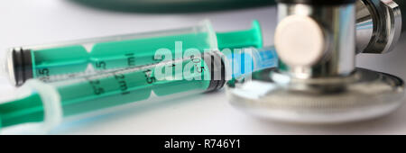 Medical stethoscope lying on paper closeup Stock Photo