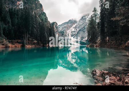 Landscape with turquoise lake and snow capped mountains, Dolomites, Italy Stock Photo