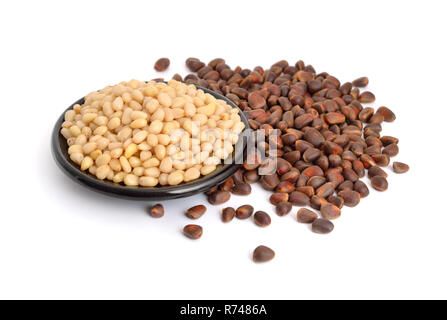 Shelled pine nuts. Isolated on white background. Stock Photo