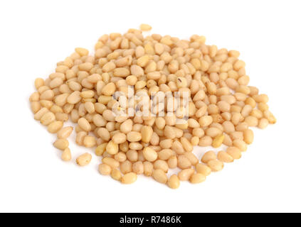 Shelled pine nuts. Isolated on white background. Stock Photo