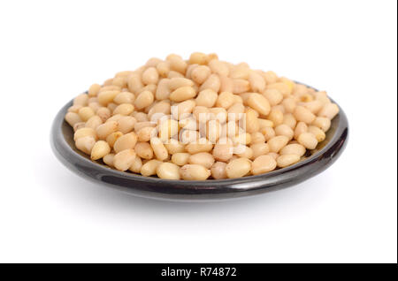Shelled pine nuts. Isolated on white background. Stock Photo