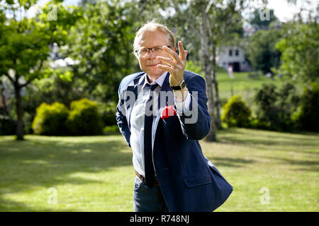 Gesticulate man in the garden Stock Photo