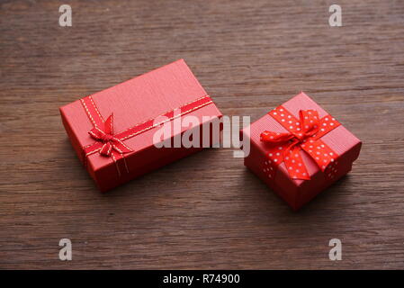 Two red gift boxes on wood table Stock Photo