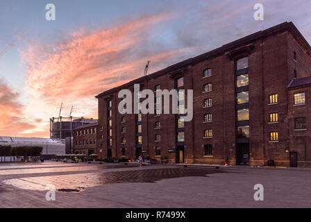 London, England, UK - June 15, 2017: Sun sets behind the brick LNER King's Cross good warehouse, now Central Saint Martin's College of the University  Stock Photo