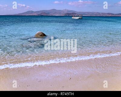 Sand on Beach and Turquoise Sea Water on Naxos Island in Greece Stock Photo