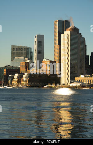 View Across Boston Harbor to the Boat Traffic fronting the Downtown City Skyline Stock Photo