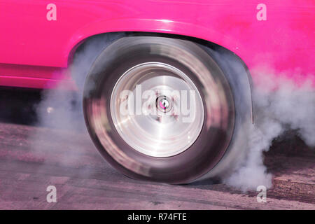 Drag Race Car warms up the tires with a burn out Stock Photo