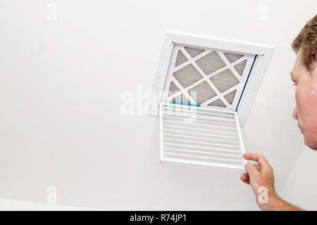 Man Opened a Vent to a Dirty Filter Stock Photo
