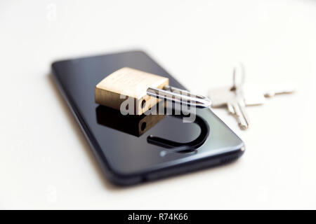 Cellphone data security - lock, keys and phone on white background Stock Photo