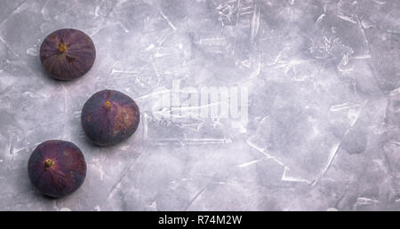Fresh figs on a concrete background, top view. Close-up. insulator Stock Photo