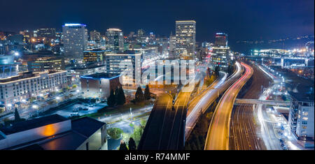 Night scene aerial view over the highway and buildings of downtown Tacoma Washington Stock Photo