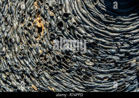 Drawings and forms on the lava flow of the island Santiago in the Galapagos, Ecuador Stock Photo