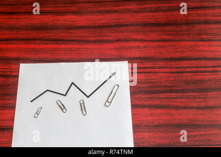 Sheet of paper with printed curve graph Stock Photo