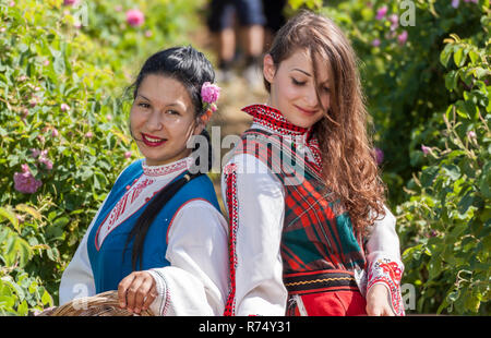 ROZOVO, BULGARIA - JUNE 06, 2015 - Rose picking ritual in Rozovo village. People dressed up in a traditional folklore costumes sing and dance for heal Stock Photo