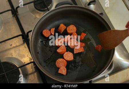 Cooking with sausages Stock Photo