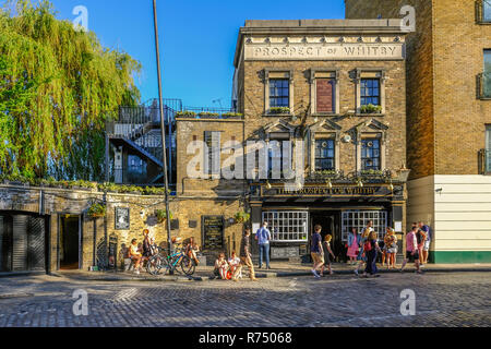 Wapping, London, UK - May 7, 2018: Horizontal shot of the Prospect of Whitby Pub in Wapping with people enjoying the sunshine outside. Afternoon shot  Stock Photo