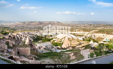 rock-cut buildings in Uchisar town in Cappadocia Stock Photo