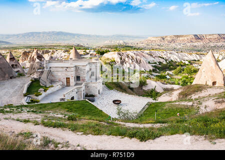 modern and ancient rock-cut houses in Uchisar Stock Photo