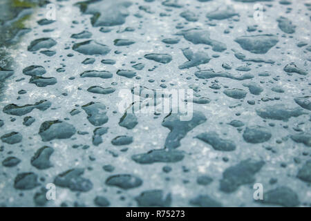 Water drop after rain on shined black marble texture ,large water drop on black marble in morning Stock Photo