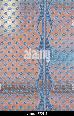 Dreamy look through a window with curtain detail. Abstract view via airy sheer decoration from lace net. Vertical line and spotted pattern background. Stock Photo