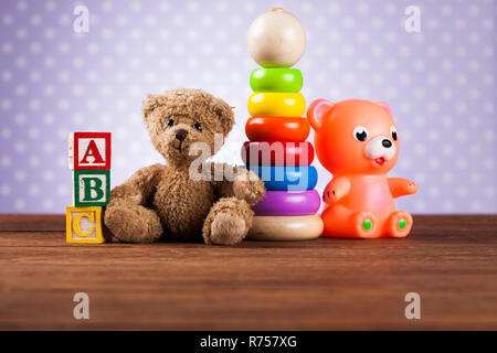 Pile of toys, collection on wooden background Stock Photo