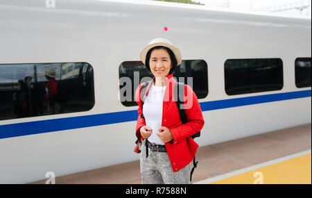 Tourist passengers traveling with China high-speed train is a quick and easy affair due to the high speed rail. Stock Photo