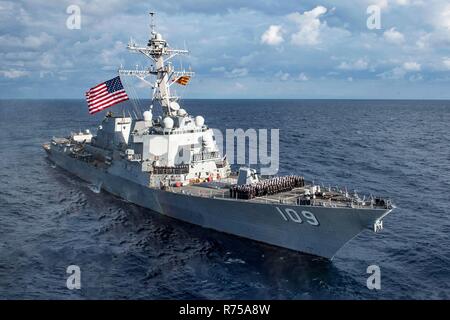 U.S. sailors aboard the Arleigh-Burke class guided-missile destroyer USS Jason Dunham pose on the foredeck for a command photo during routine patrol in the Mediterreanean Sea December 2, 2018 off the coast of Spain. Stock Photo