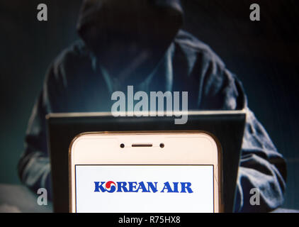 Hong Kong. 23rd Nov, 2018. Largest airline and flag carrier of South Korea, Korean Air, logo is seen on an Android mobile device with a figure of hacker in the background. Credit: Miguel Candela/SOPA Images/ZUMA Wire/Alamy Live News Stock Photo
