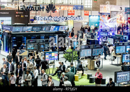 Hanover, Germany. 13th June, 2018. Visitors walking past the stand from the company Huawei at the digitalisation fair Cebit. After three decades, Cebit is trying a 'Festival' format comeback between the 11 and 15 of June. Credit: Hauke-Christian Dittrich/dpa | usage worldwide/dpa/Alamy Live News Stock Photo