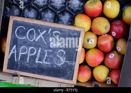 Box of Cox's Apples outside fruit shop. Stock Photo