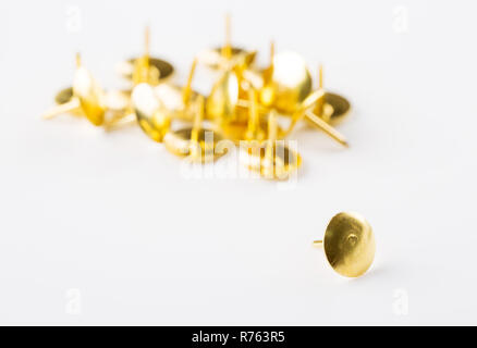 Closeup metal tacks on a white. Office concept Stock Photo