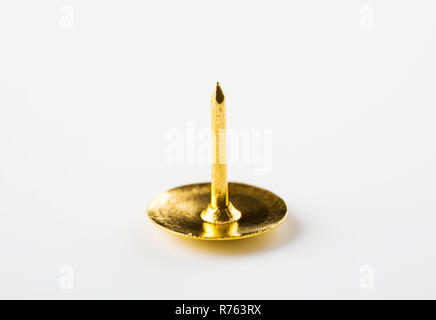 Closeup metal tack on a white. Office concept Stock Photo