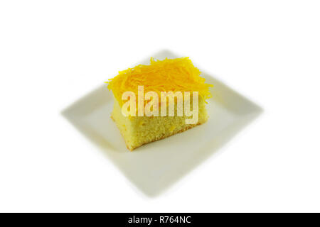 golden egg yolks threads isolated thai desserts on white plate on white background / name in thai Foi Thong yellow egg yolks threads Stock Photo