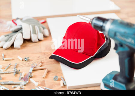 Furniture assembly parts and tools for self assembly furniture, on the floor Stock Photo